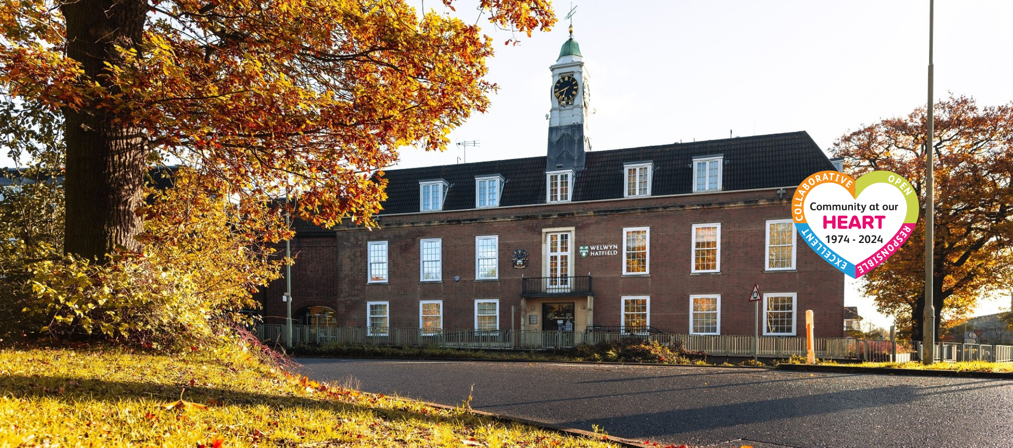 campus east office with autumnal trees to the left of it